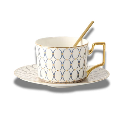 Top view of porcelain tea cup set with gold handle and matching saucer