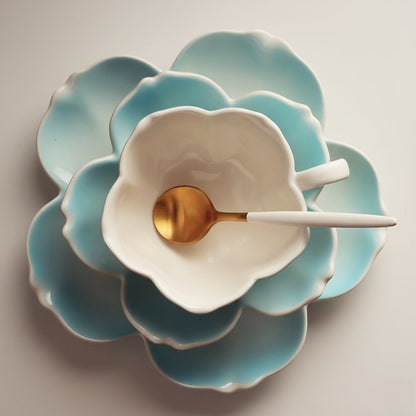 Porcelain tea cup set with floral petal design and matching saucer for afternoon tea