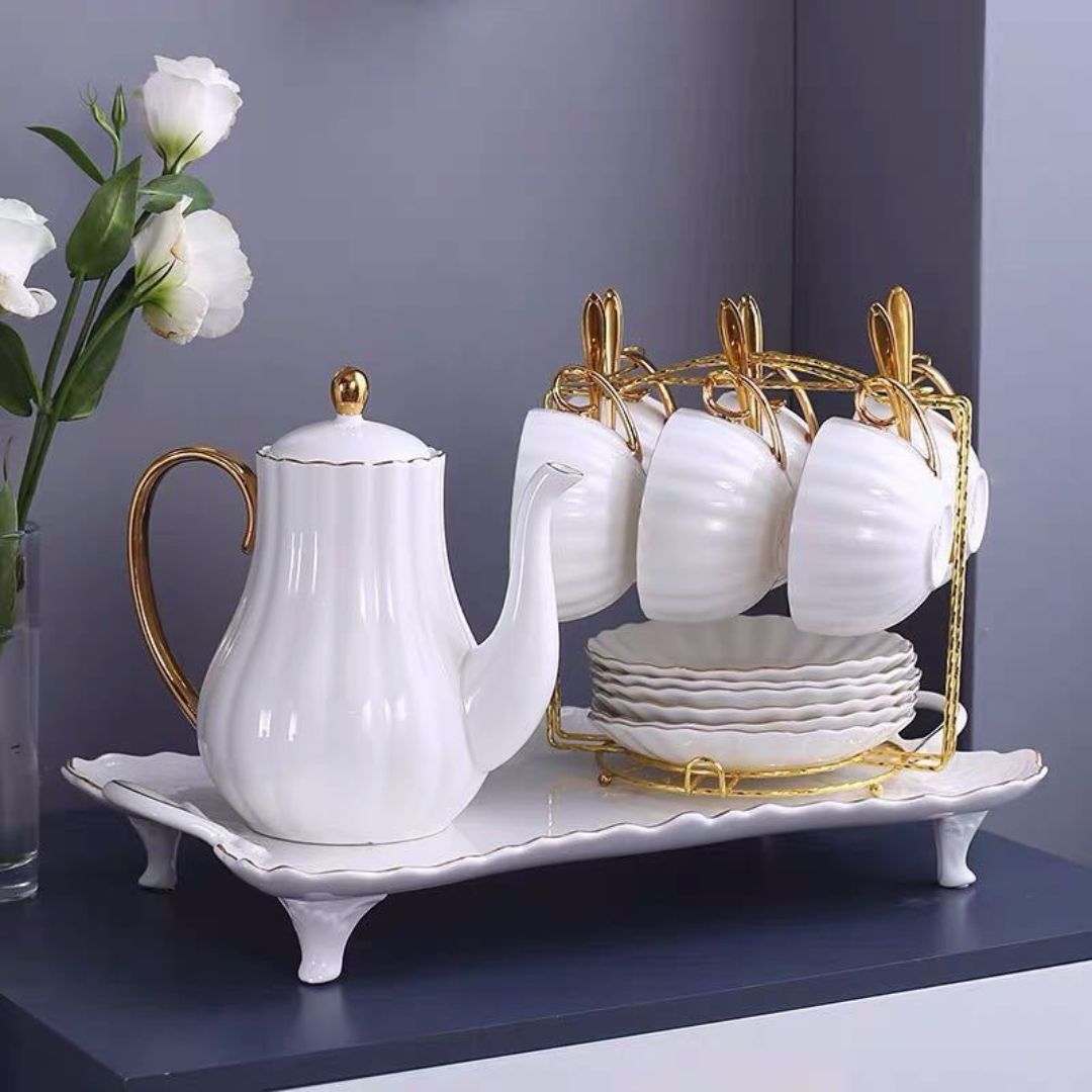 Fine ceramic teacup with hand painted gold rim and ribbed pumpkin design for hot beverages