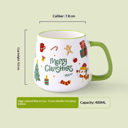 Ceramic holiday mug featuring Christmas tree and snowflake design with red handle