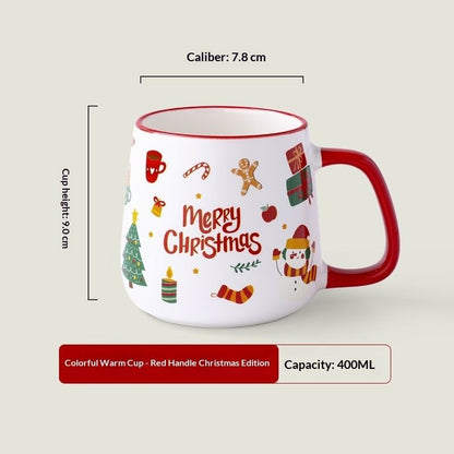 White ceramic Christmas mug with colorful festive icons and red accent handle
