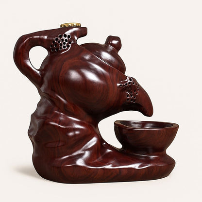 Hand carved ebony incense holder with curved spout and smooth polished surface