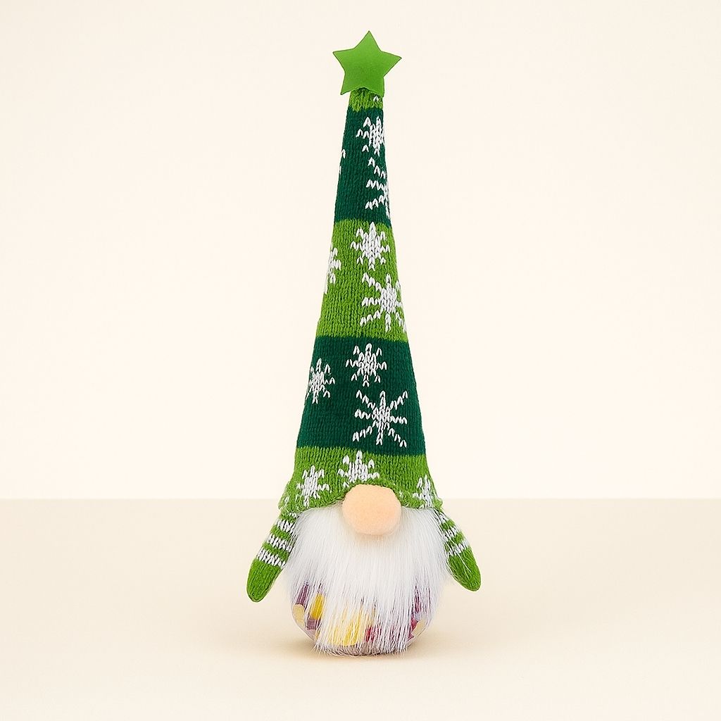 Christmas gnome decoration with white fluffy beard and red knitted hat on white background