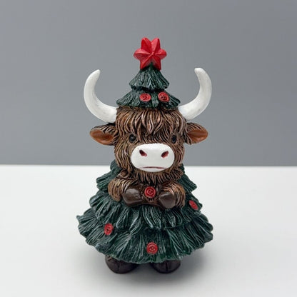 Festive cattle ornament featuring detailed sculpted head and holiday tree costume