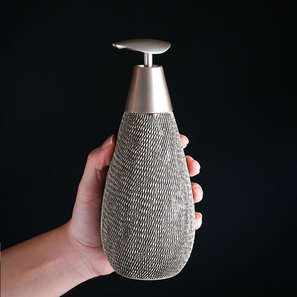 Japanese ceramic soap dispenser featuring brushed texture and retro styling for bathroom use