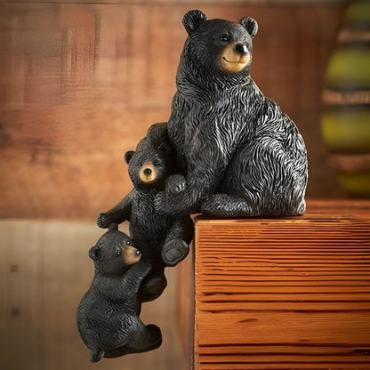 Three bear figurines on a wooden surface with a blurred background