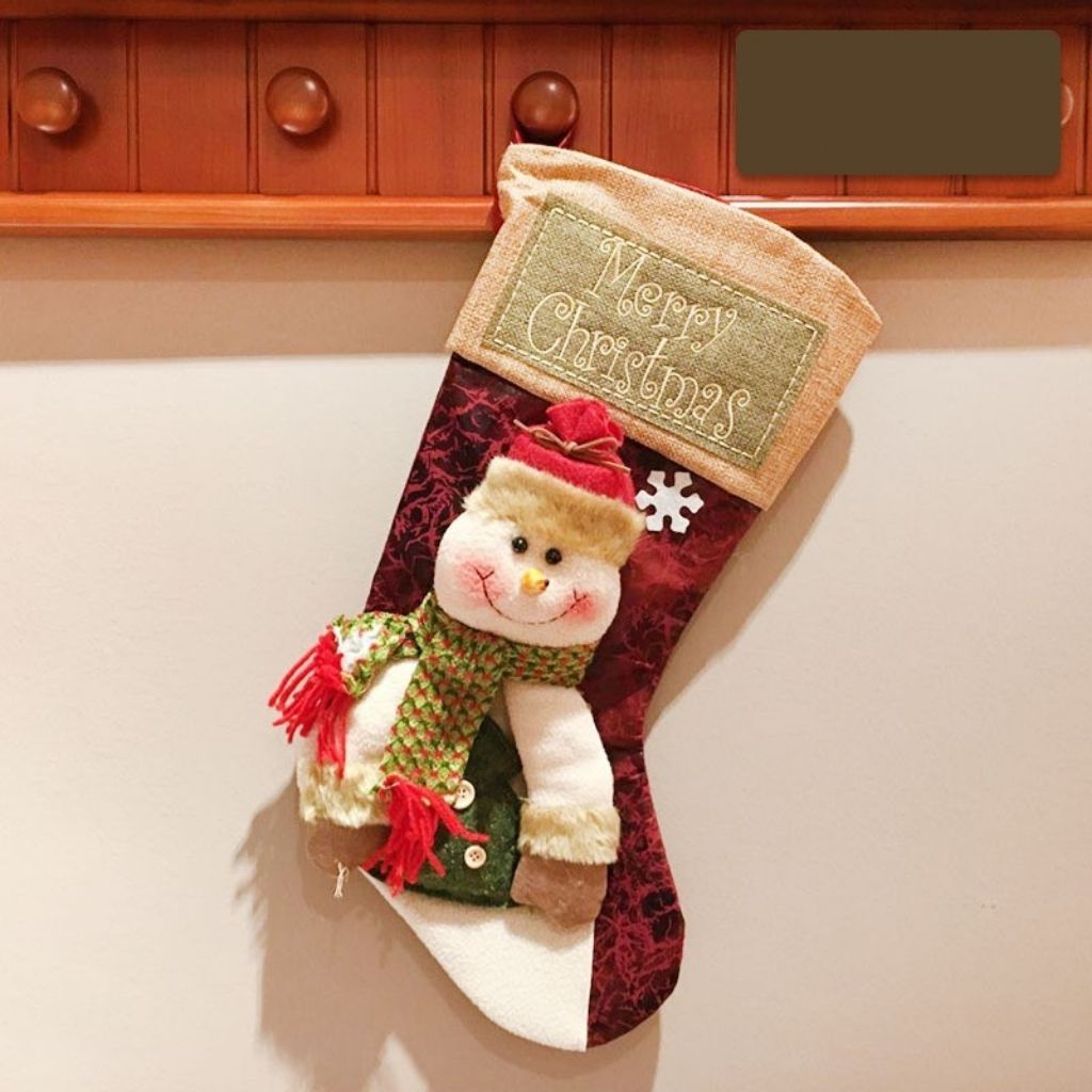 Seasonal stocking with plush reindeer detail ready for fireplace or wall display