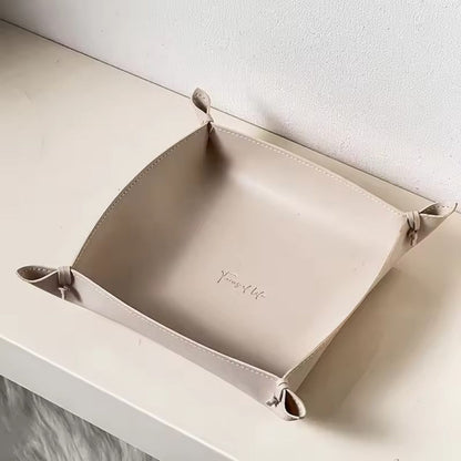 Leather jewelry tray organizing earrings, rings and small accessories with clean stitched edge design