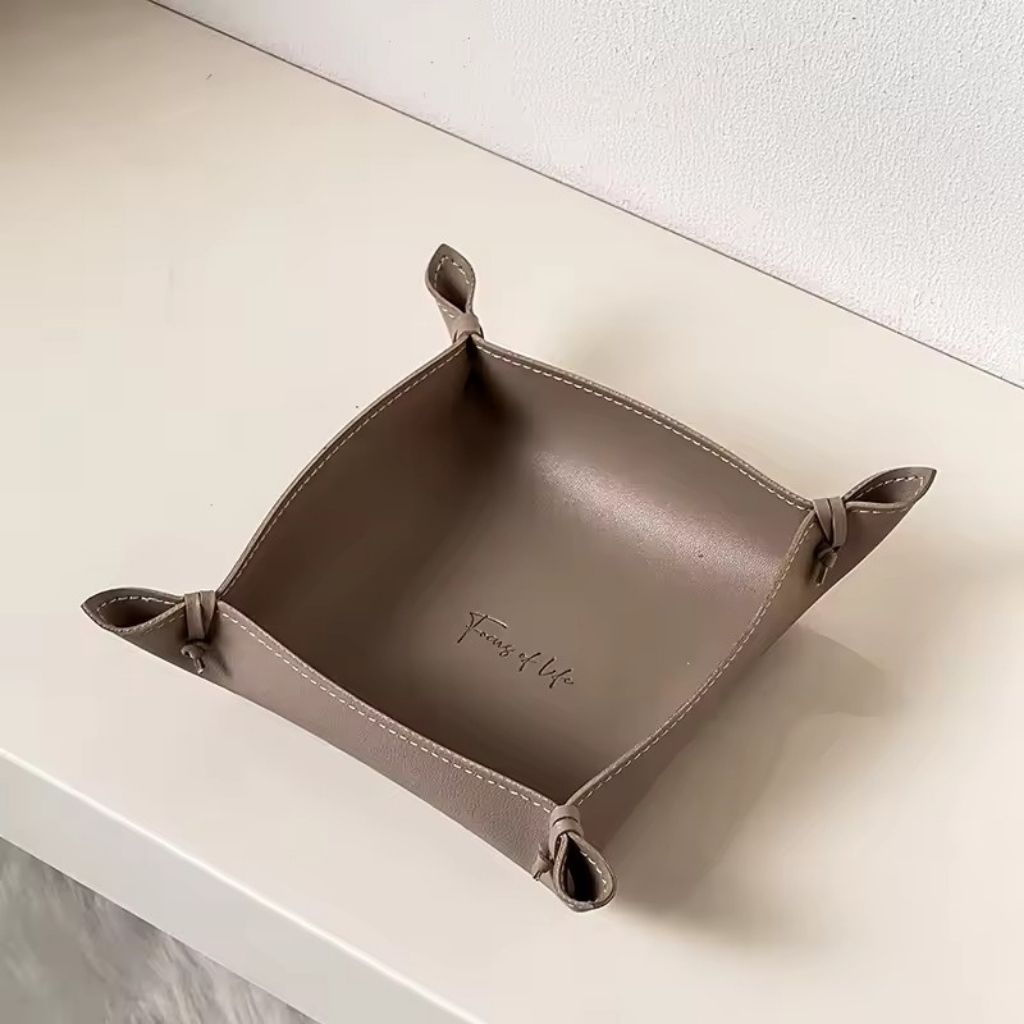 High quality faux leather storage tray with durable stitched construction for long lasting organization


