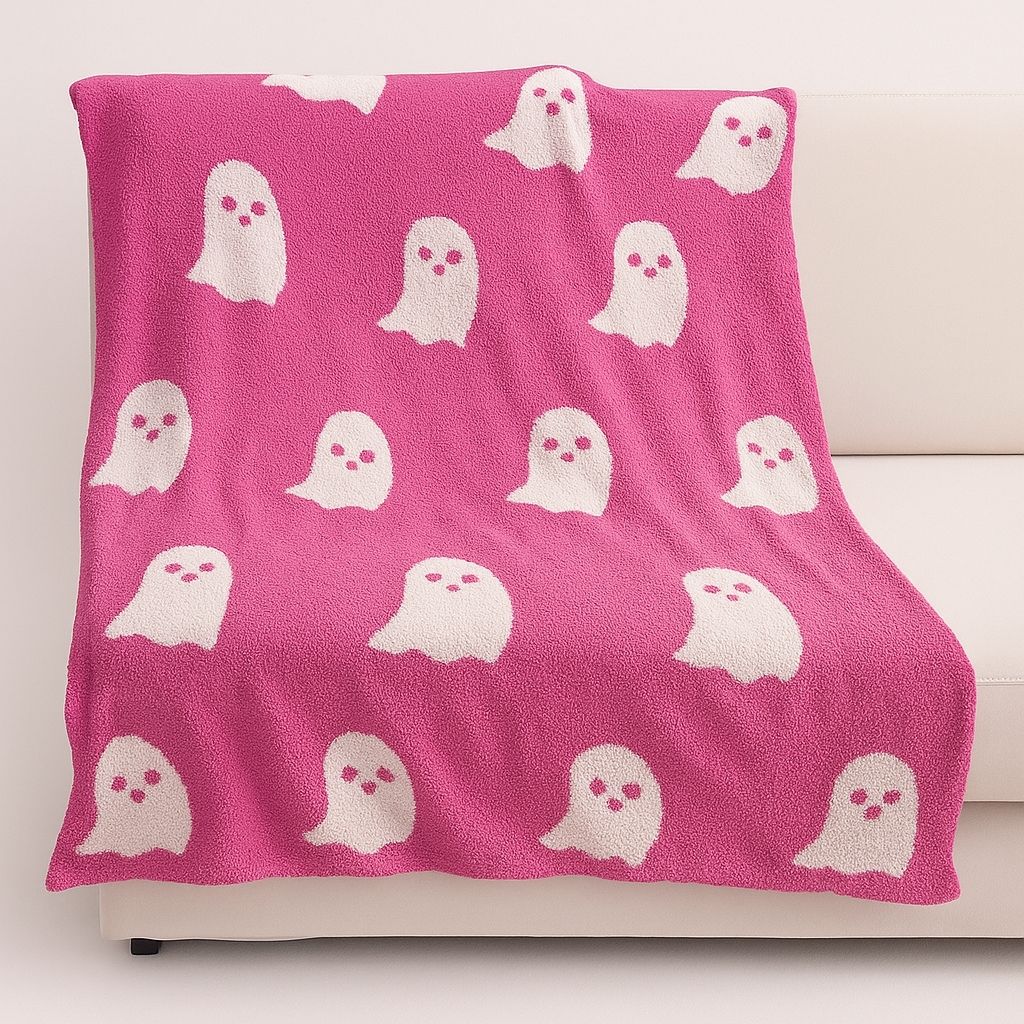 Seasonal throw blanket with charming ghost design, ideal knitted home textile for year-round use