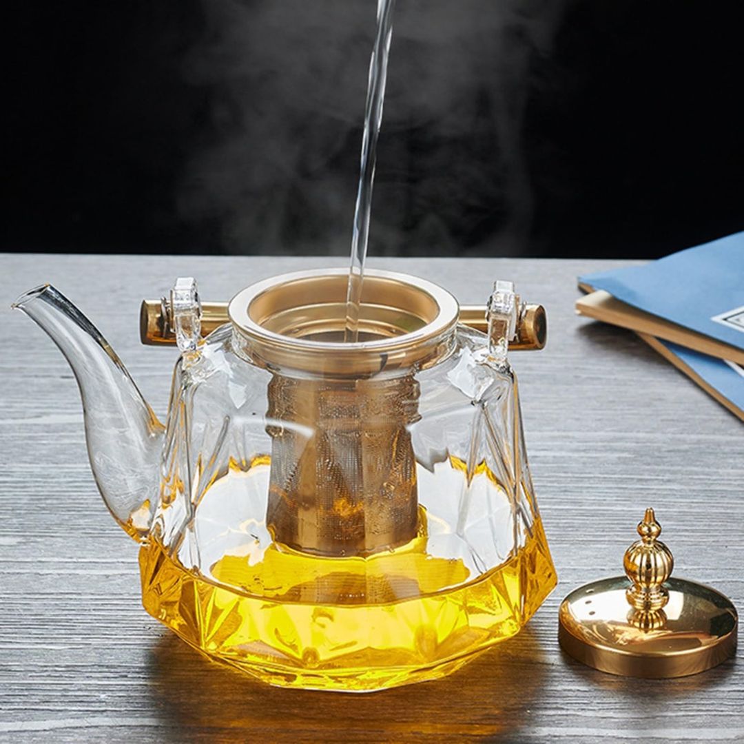 Modern stovetop safe glass teapot with electroplated metal handle and integrated tea filter