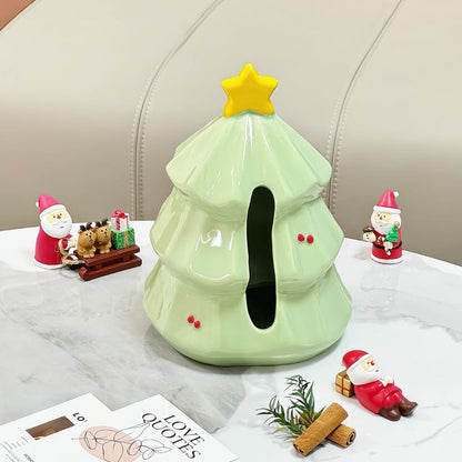 Green ceramic Christmas tree tissue dispenser with smooth glossy surface and star accent