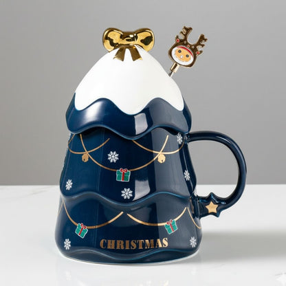 Pink ceramic mug with Christmas lid and matching spoon on white background