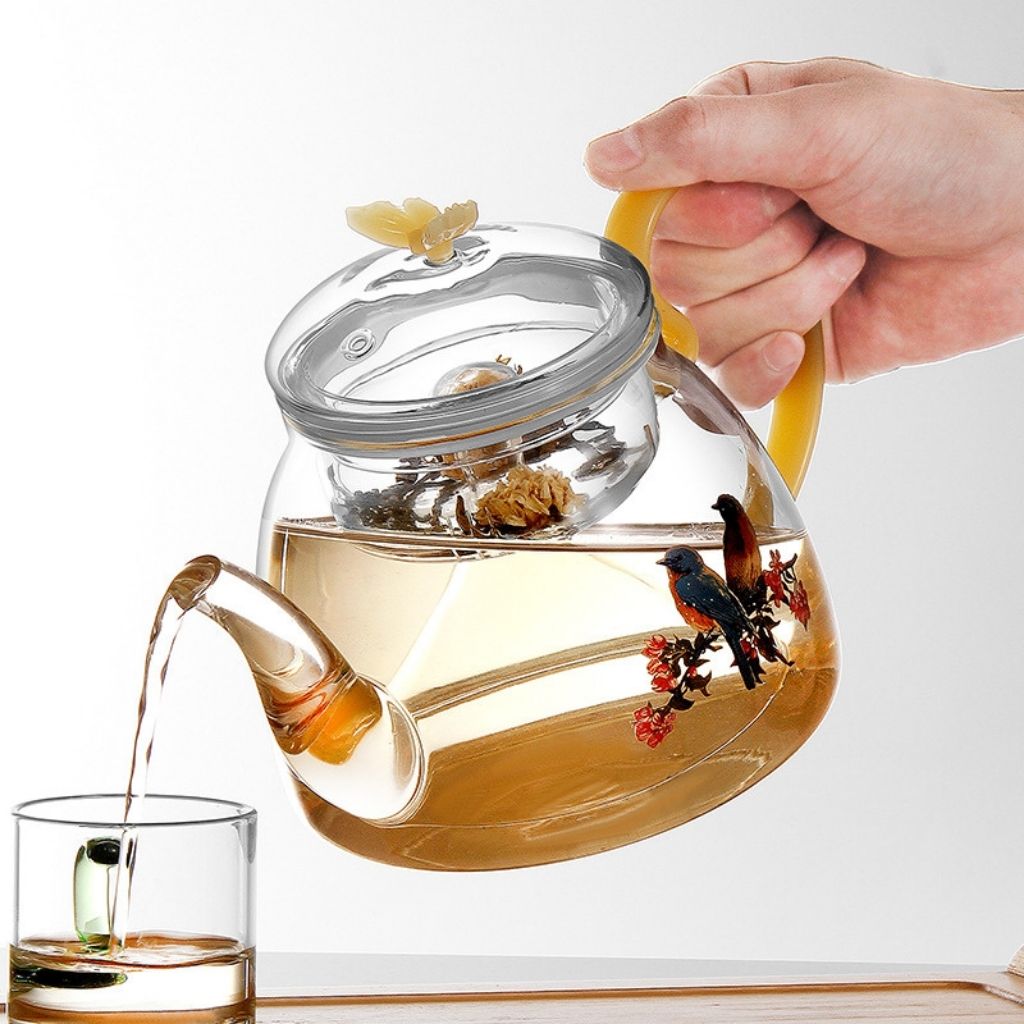 Transparent glass tea pot with integrated loose leaf infuser system