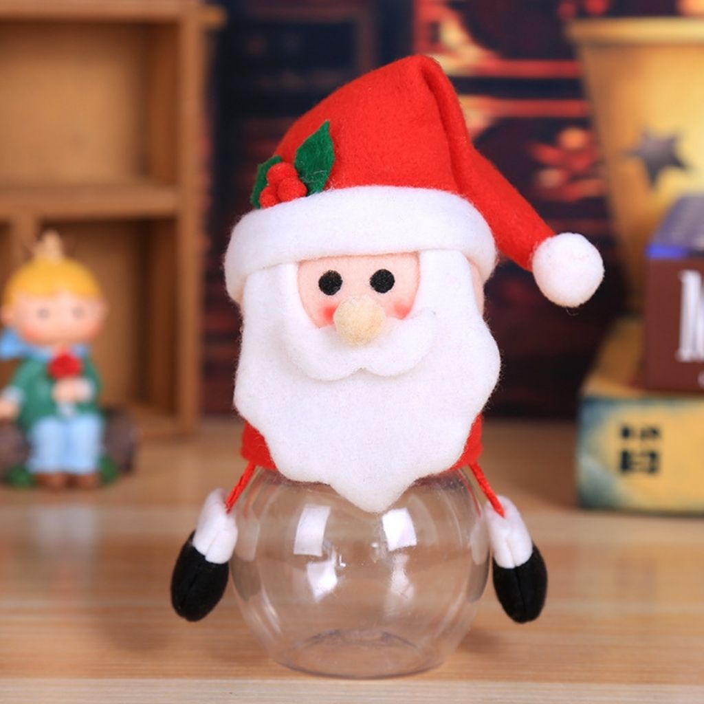 Plush topped candy storage jar filled with wrapped sweets for Christmas gifting