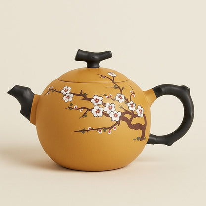 Purple sand clay teapot with hand carved plum blossom relief and curved spout