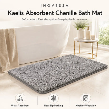 Gray bath mat in a bathroom setting with INOVESSA branding and product features.