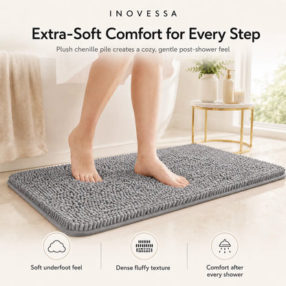 Person standing on a gray bath mat with INOVESSA branding and product features.