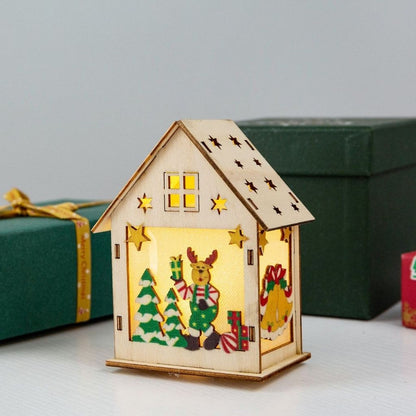 Wooden house-shaped lantern with Christmas design on a light background