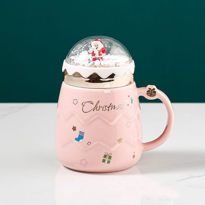 Festive ceramic mug with miniature snow globe lid and glossy glazed finish