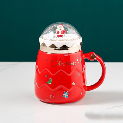 Ceramic Christmas mug with decorative snow globe topper and rounded body design