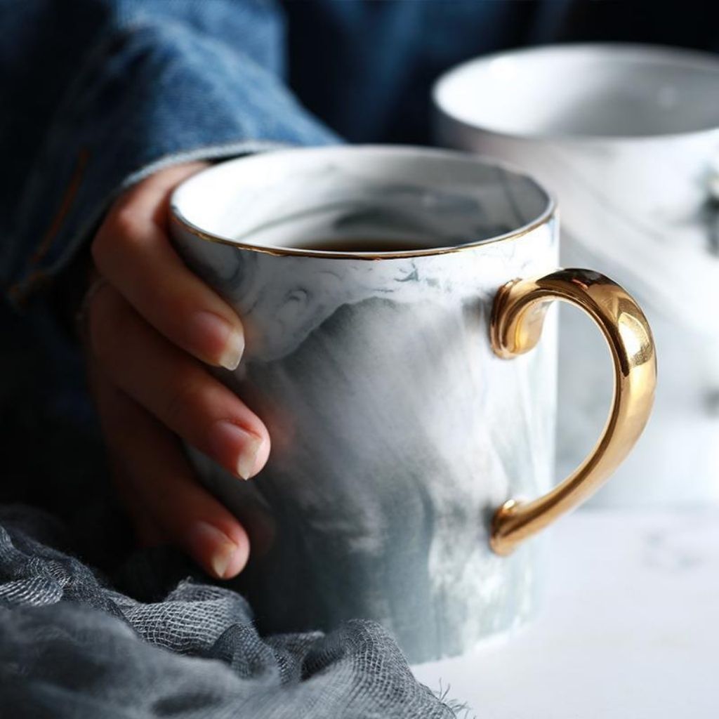 Marble pattern ceramic mug with gold handle ideal for morning coffee afternoon tea serving