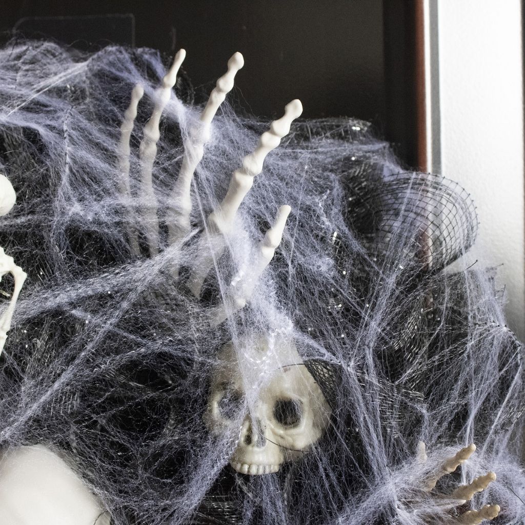 Mesh skull decoration featuring layered polyester fiber with woven bones for halloween party backdrops