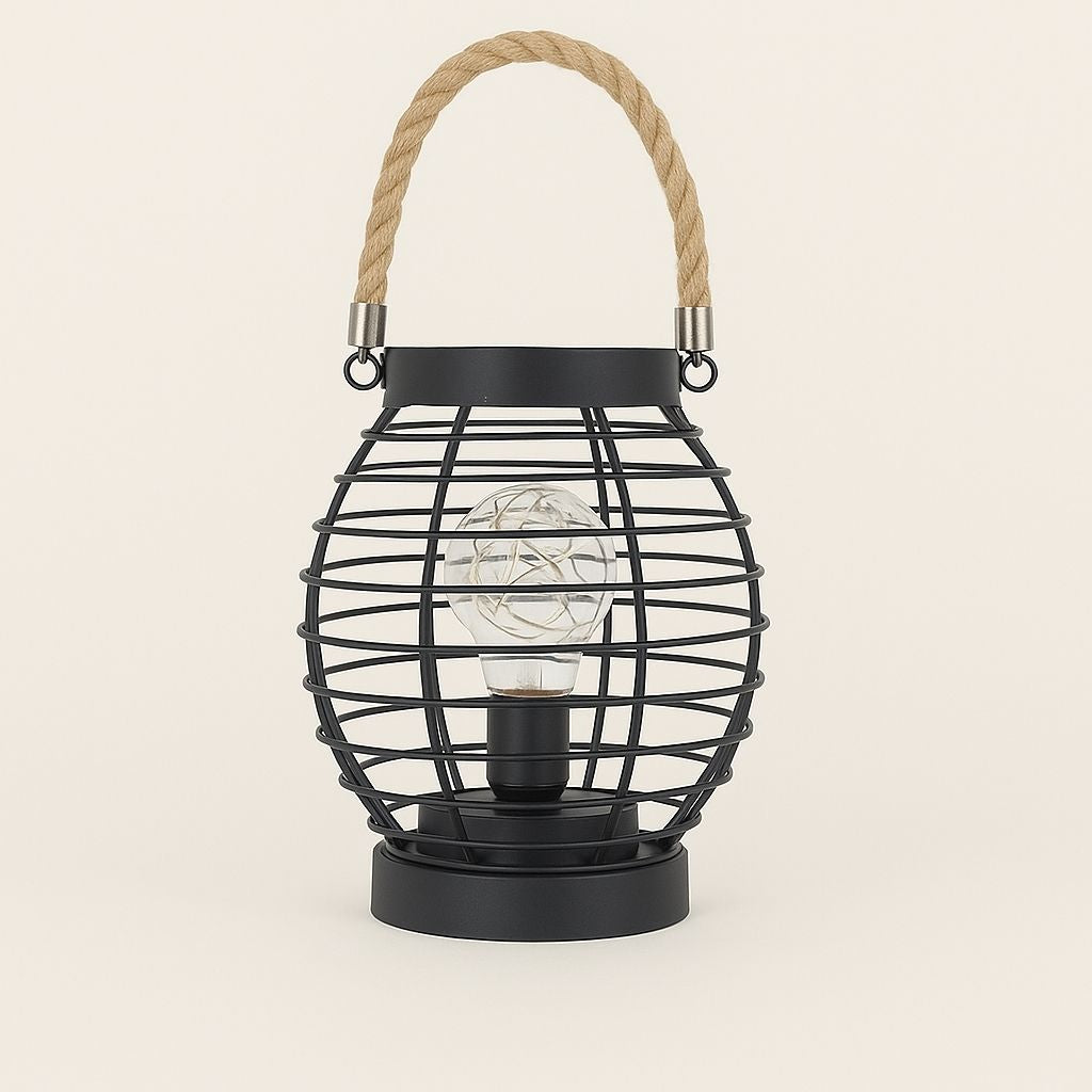 Black lamp wire cage lantern with a rope handle on a beige background