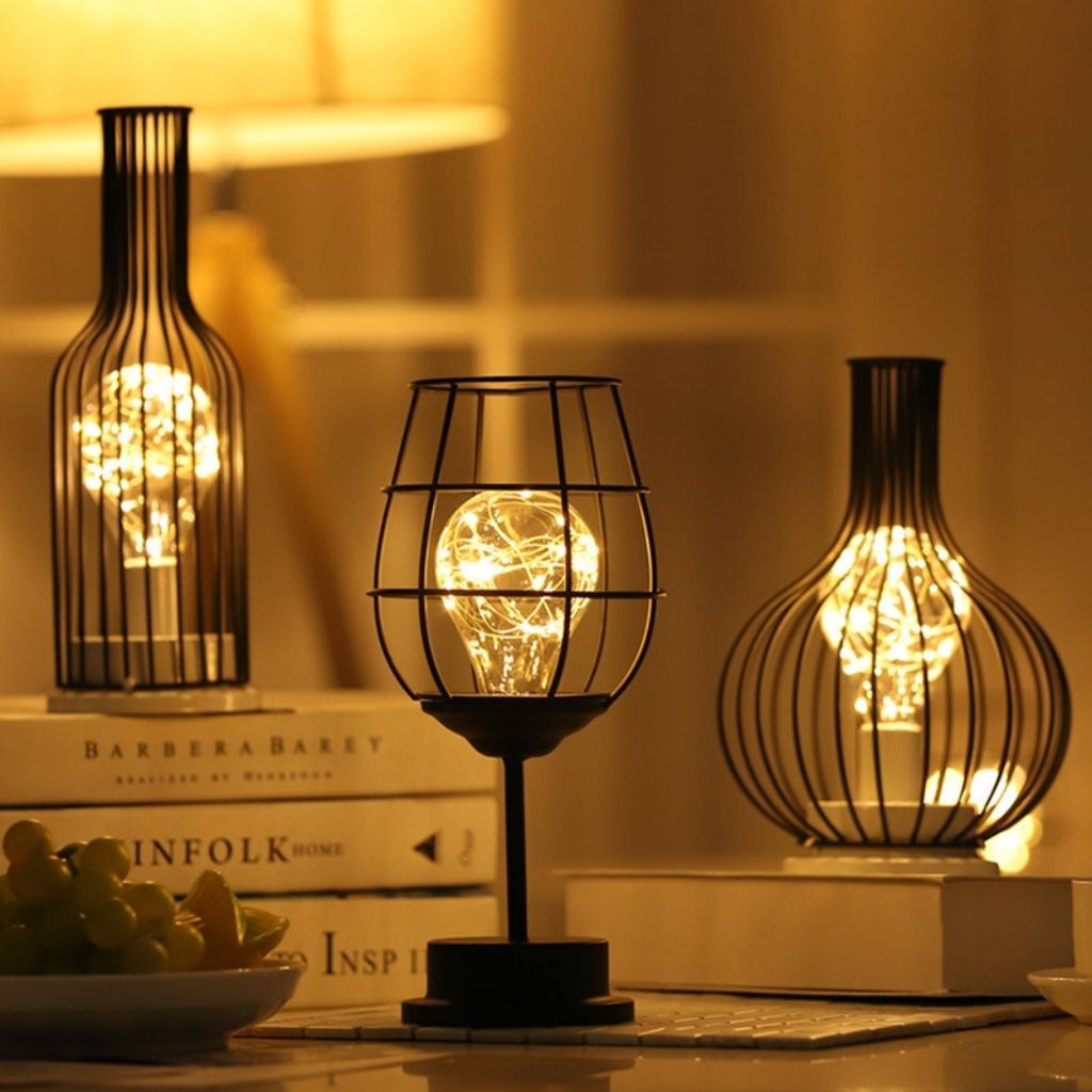 Decorative metal wire table lamp featuring LED bulb and industrial cage design for stylish home accent lighting