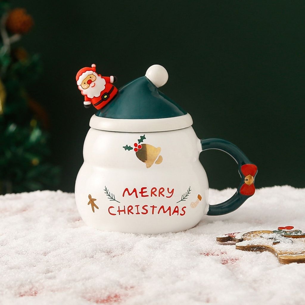Ceramic lidded mug with Santa figure and bell motif, novelty fit for seasonal use.