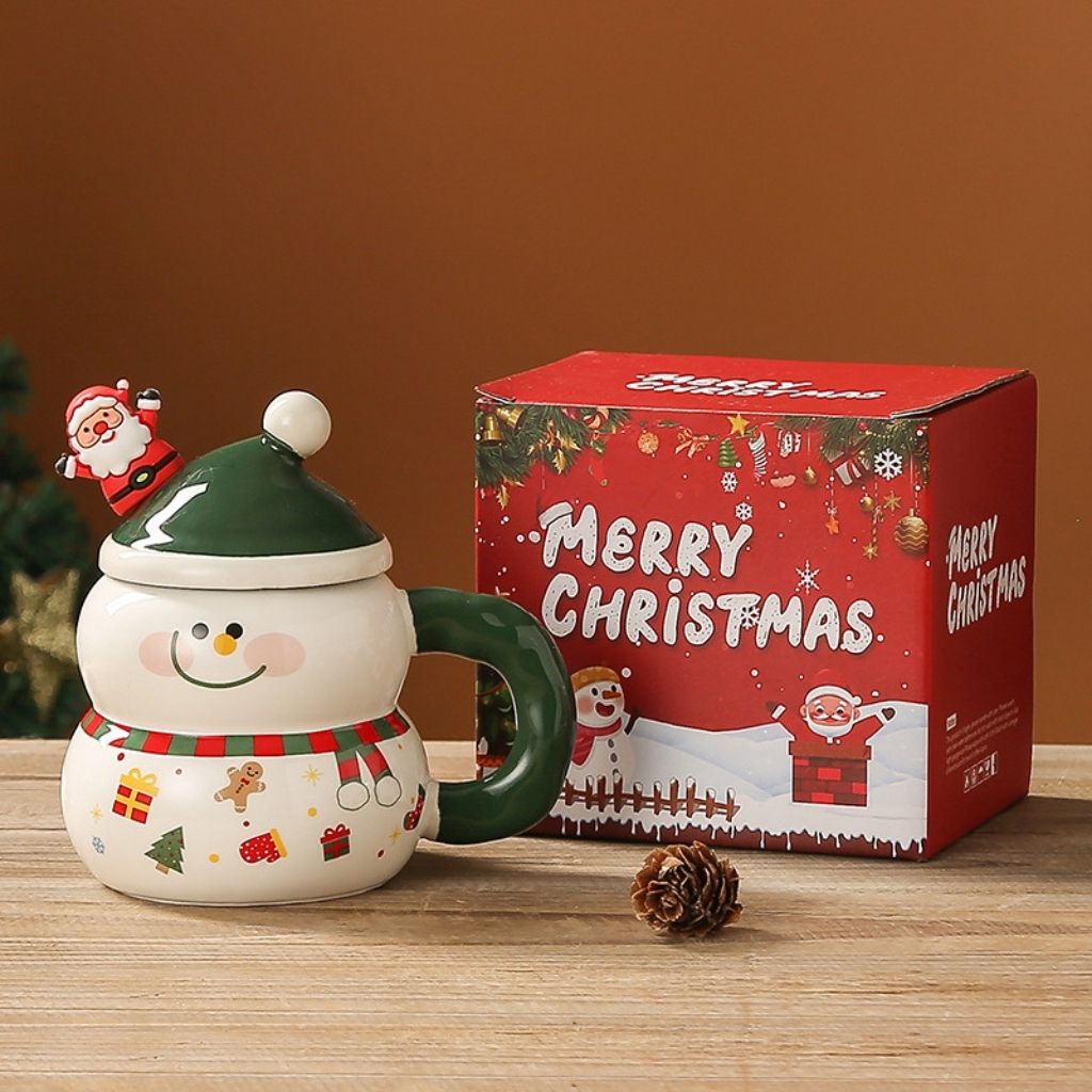 Ceramic holiday cup with bright handle and seasonal cartoon design