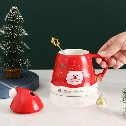Holiday mug with spoon resting on lid showing complete three piece set