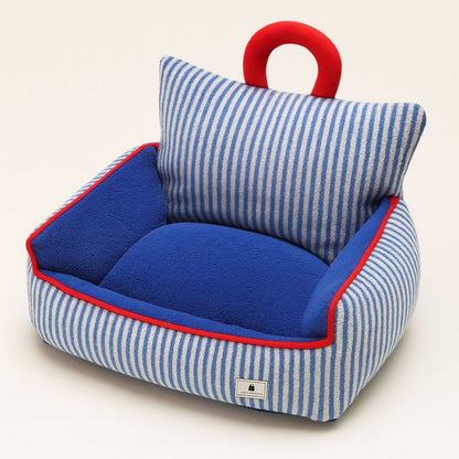 Dog bed with raised sides and plush fabric for winter warmth and comfort