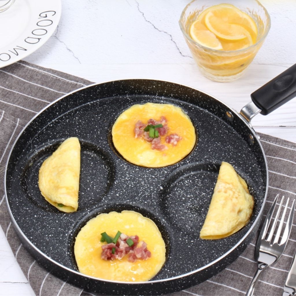 Multi-section breakfast pan featuring ergonomic heat-resistant handle and durable nonstick surface coating