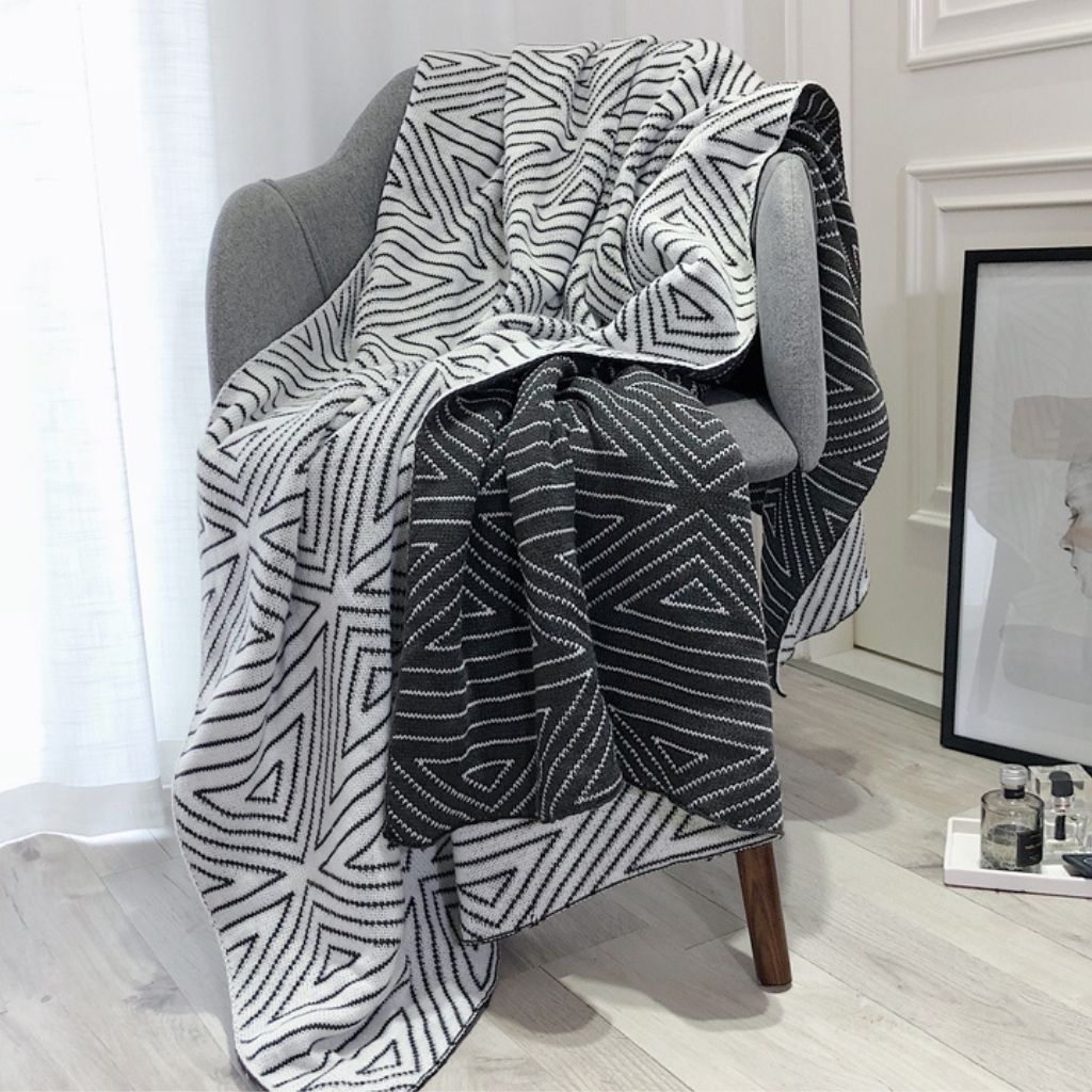 Geometric throw blanket featuring nordic design crafted from soft acrylic material for year-round use