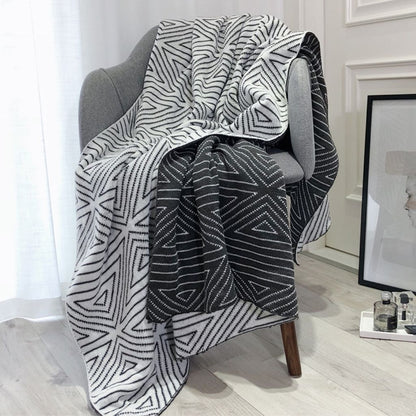 Geometric throw blanket featuring nordic design crafted from soft acrylic material for year-round use