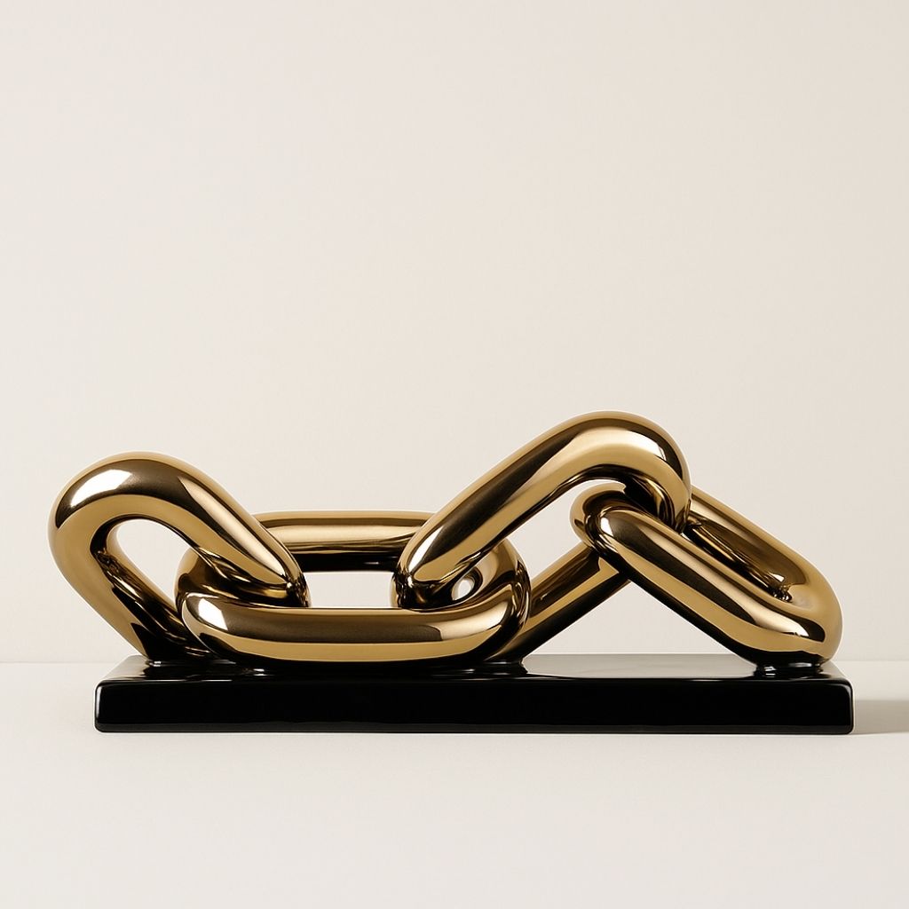 Gold chain sculpture on a white background