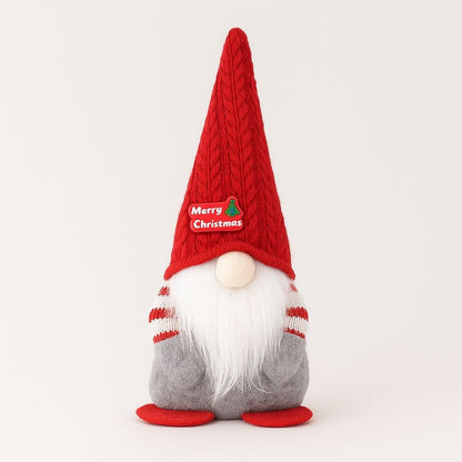Faceless gnome ornament with red knitted pointed hat and white plush beard for Christmas display