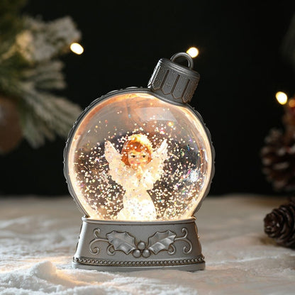 Lightweight plastic snow globe ornament with built in LED illumination