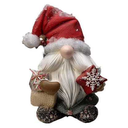 Red hat gnome figurine with wrapped present and white beard for holiday mantel decor