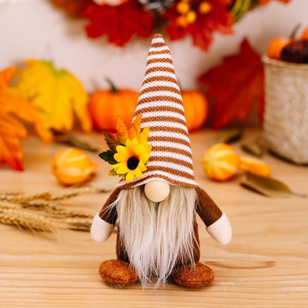 Polyester gnome dolls with tall patterned hats and long fabric beards in autumn colors