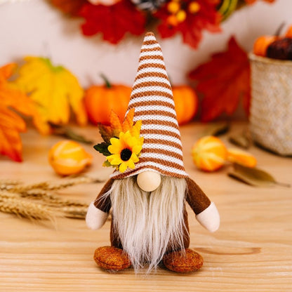 Harvest gnome figurines with sunflower details and fabric beards for tabletop display
