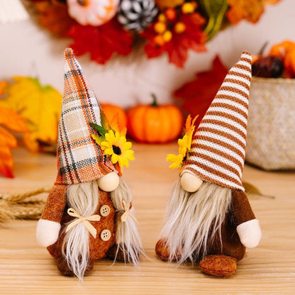 Pastoral gnome dolls with long fabric beards and autumn harvest colors for shelf display