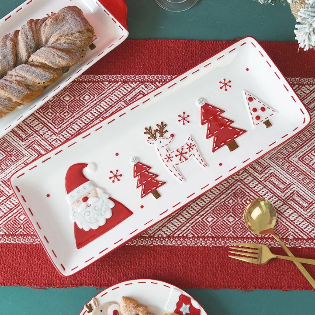 White ceramic serving dish with festive holiday design and easy grip handles