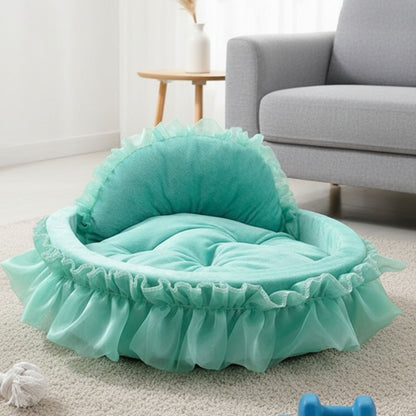 Soft cushioned cat bed with decorative ruffle trim and curved support