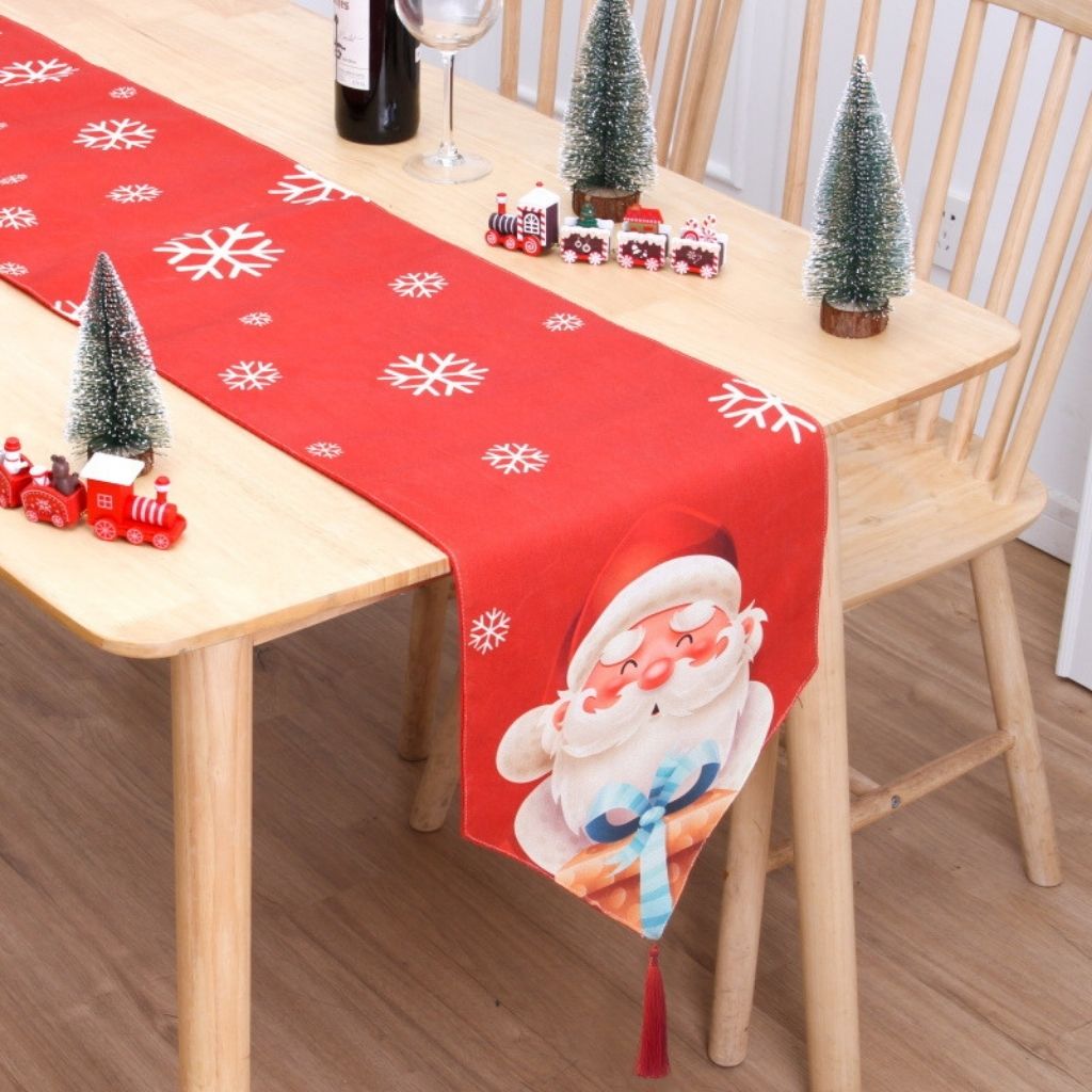 Flannel holiday table runner displaying festive pattern for seasonal home decor