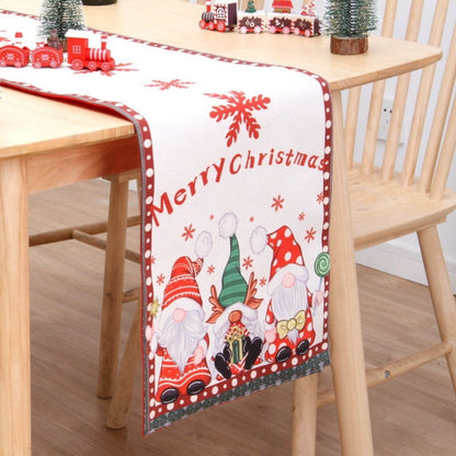 Double sided flannel table runner with red and white holiday graphics on dining table