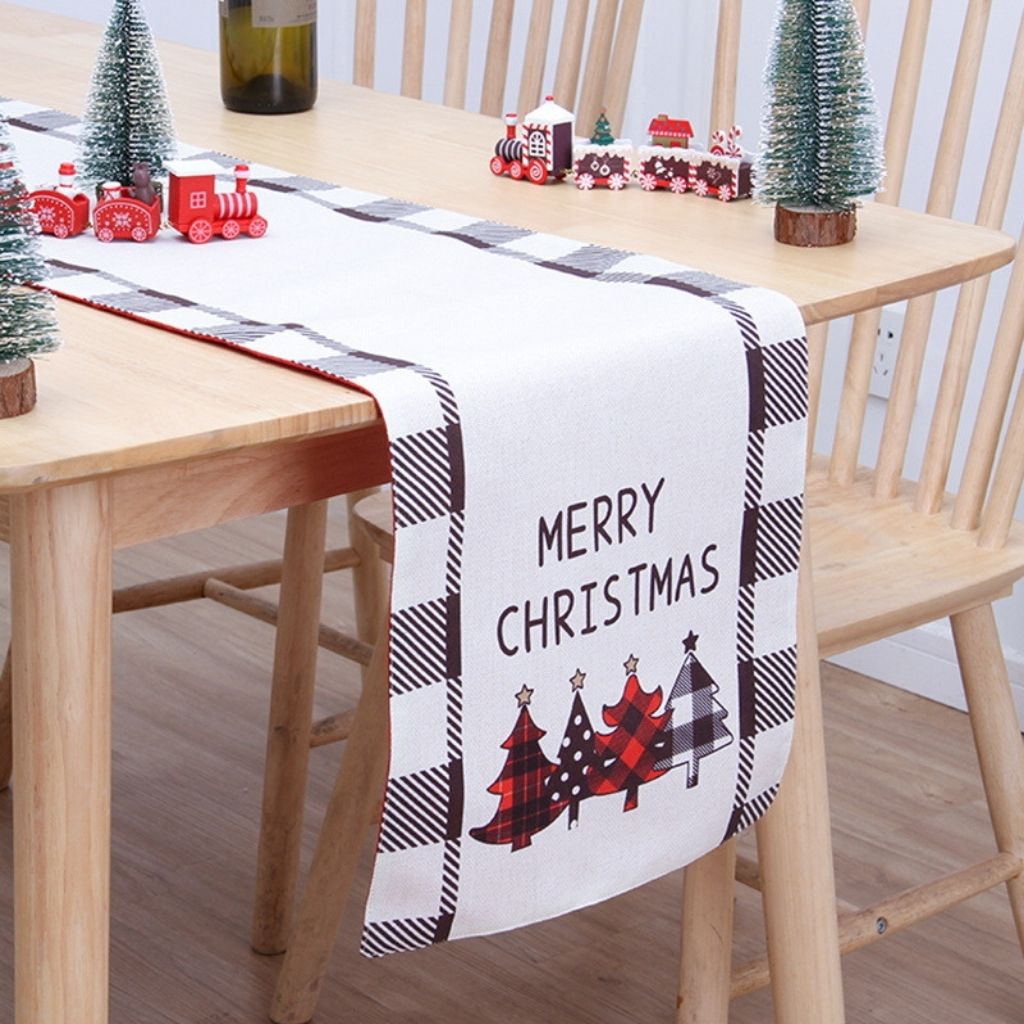 Festive Christmas table runner featuring snowflake and holiday pattern in red tones