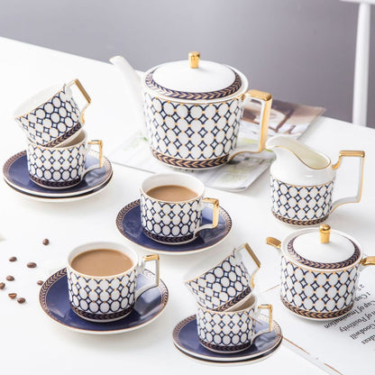 Porcelain coffee set with bone china teacups and white ceramic serving pieces
