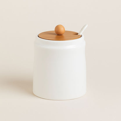Handcrafted ceramic seasoning storage jar with natural bamboo lid designed for modern kitchen organization